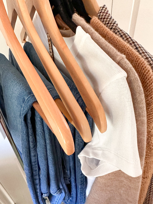 Fall capsule wardrobe on hangers.