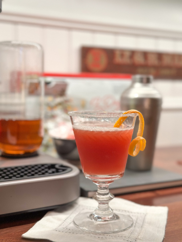 Bartesian Santas Punch cocktail on bar counter.