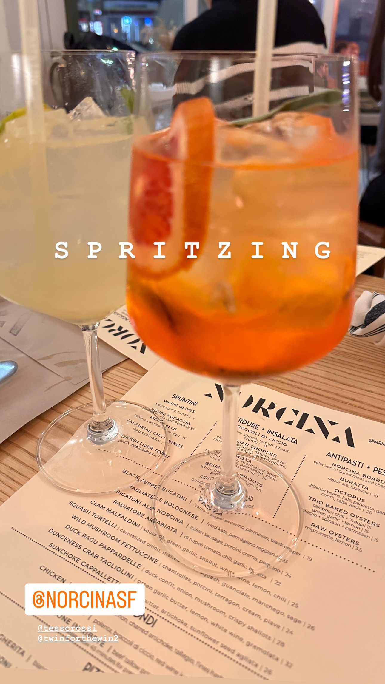 Spritzer's sitting on menu at Norcina, San Francisco.