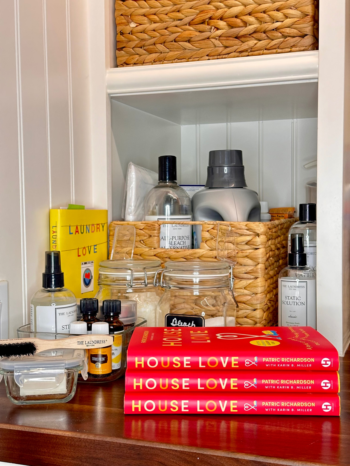 House Love books on laundry room countertop.