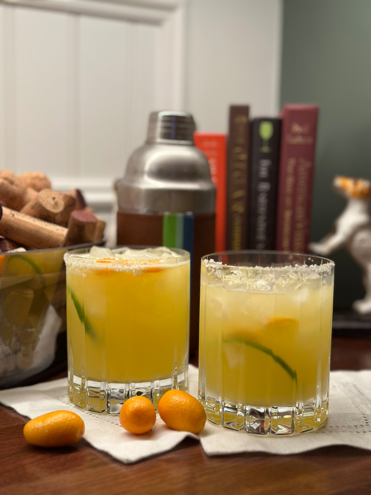 Two glasses of Cara Cara margaritas on the bar.