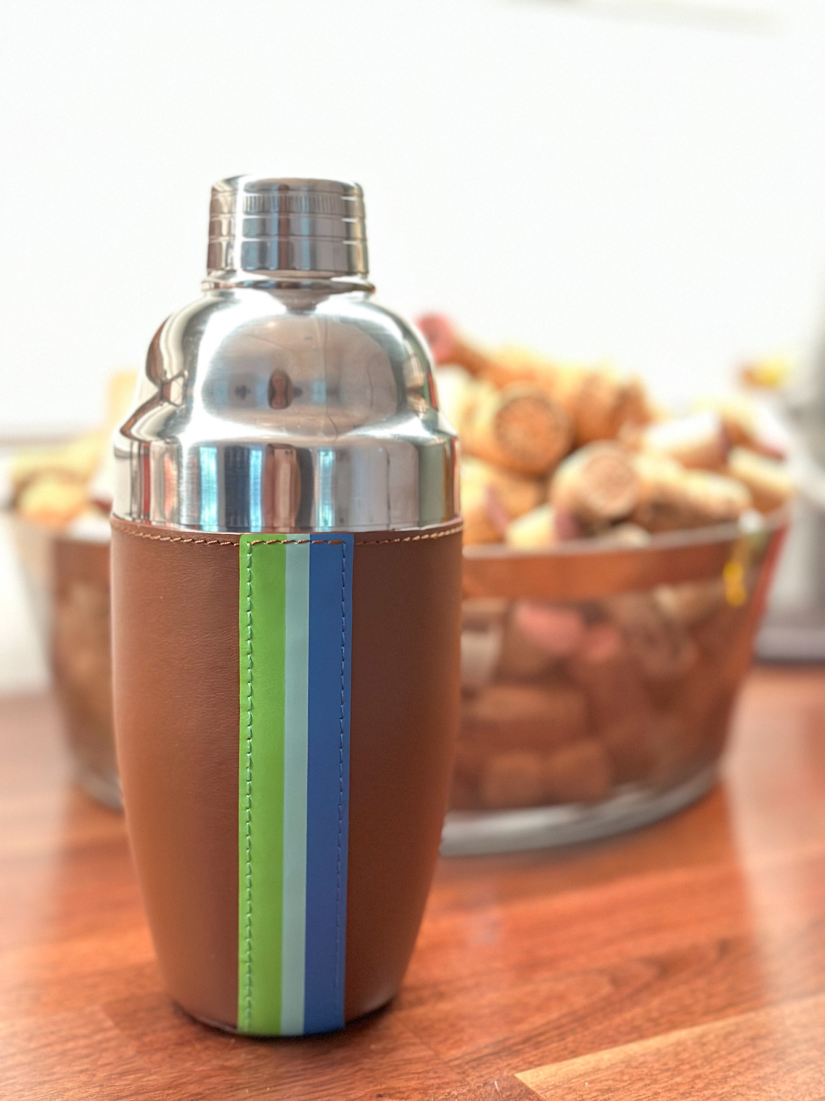 Ivy Cove cocktail shaker on bar in front of bowl of corks.