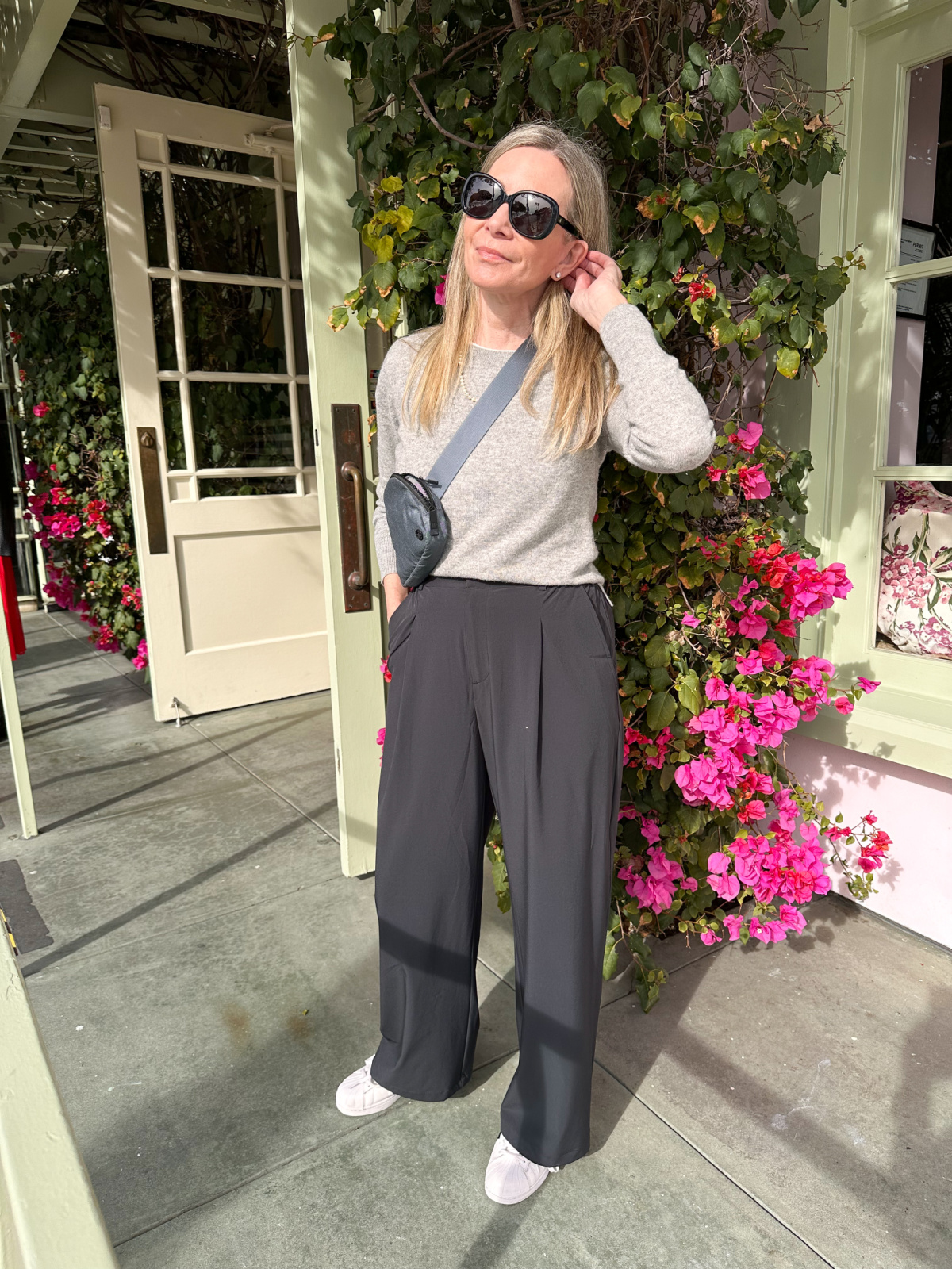 Woman standing in front of Ivy at the Shore.