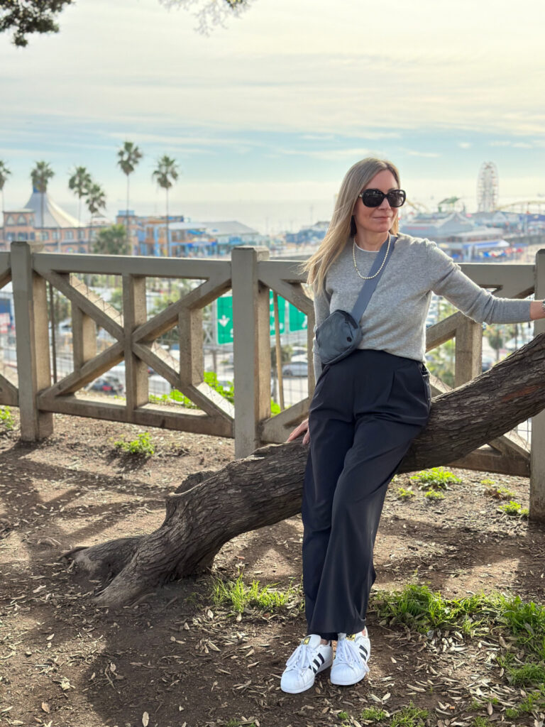 Woman standing on beach walk in Santa Monica.