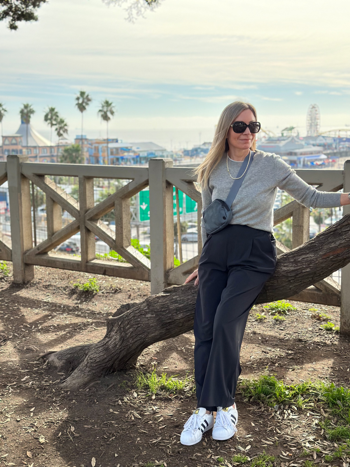 Woman standing on beach walk in Santa Monica.