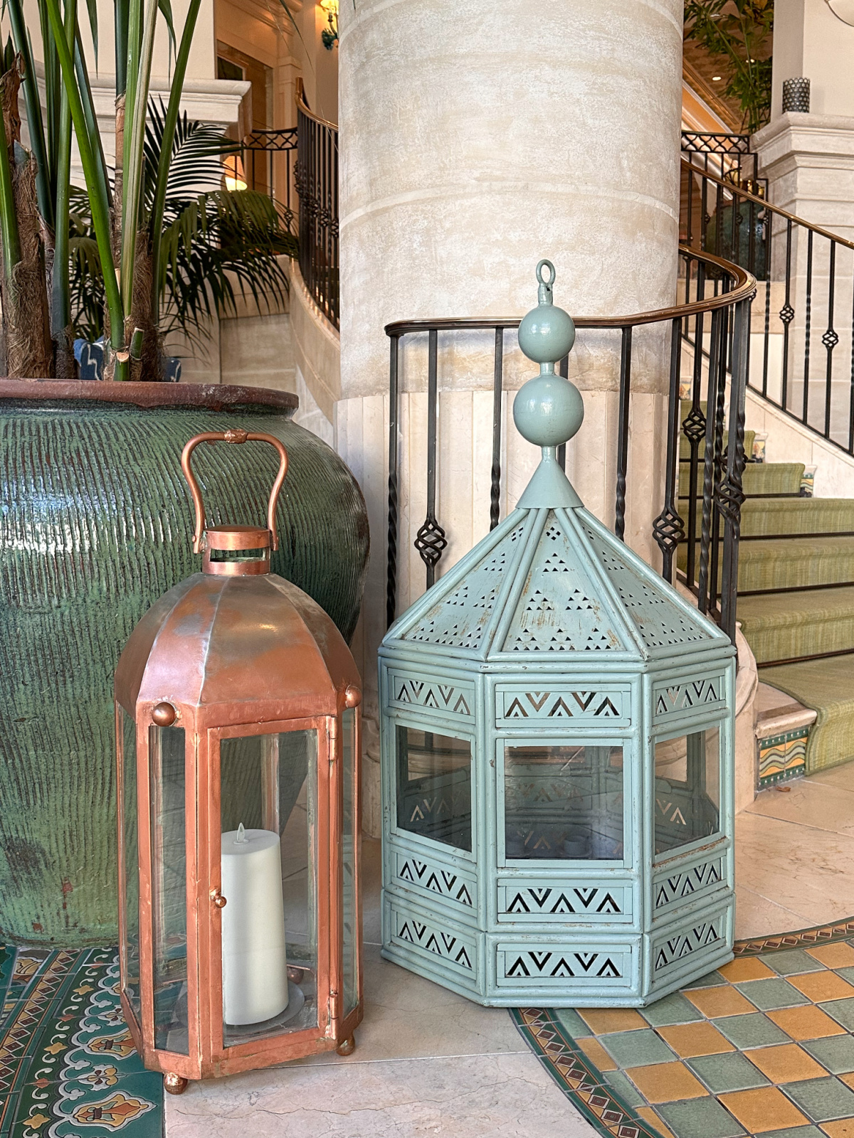 Lanturns next to potted palm as Casa Del Mar.