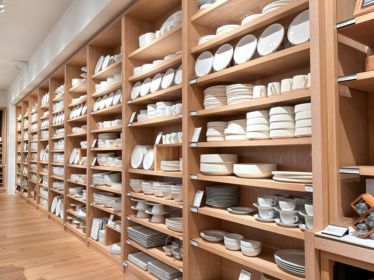 Interior display of white serveware at Crate & Barrel.