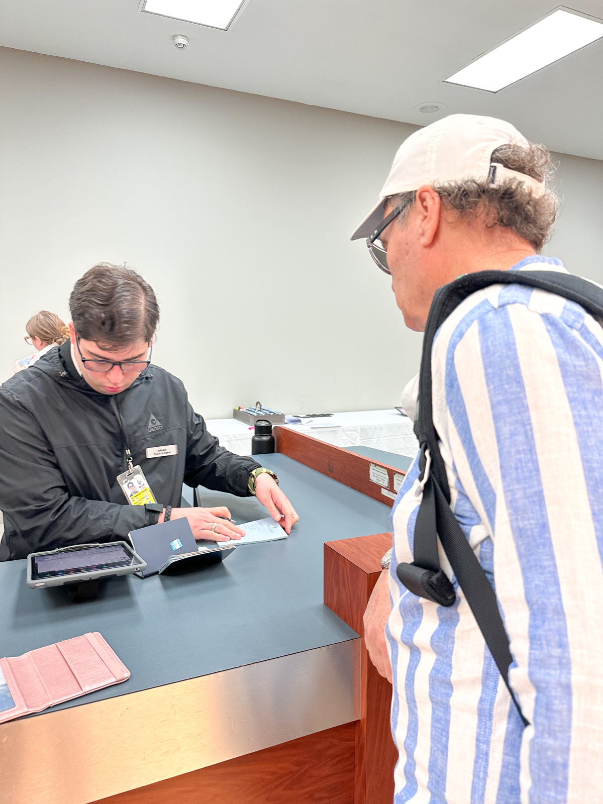 Man checking in for Ritz Carlton Yacht Collection cruise.