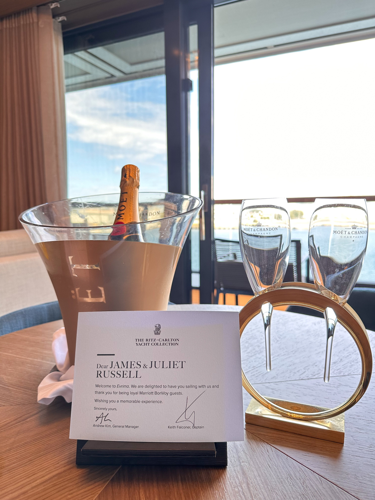 Welcome champagne bottle in bucket with welcome glasses.