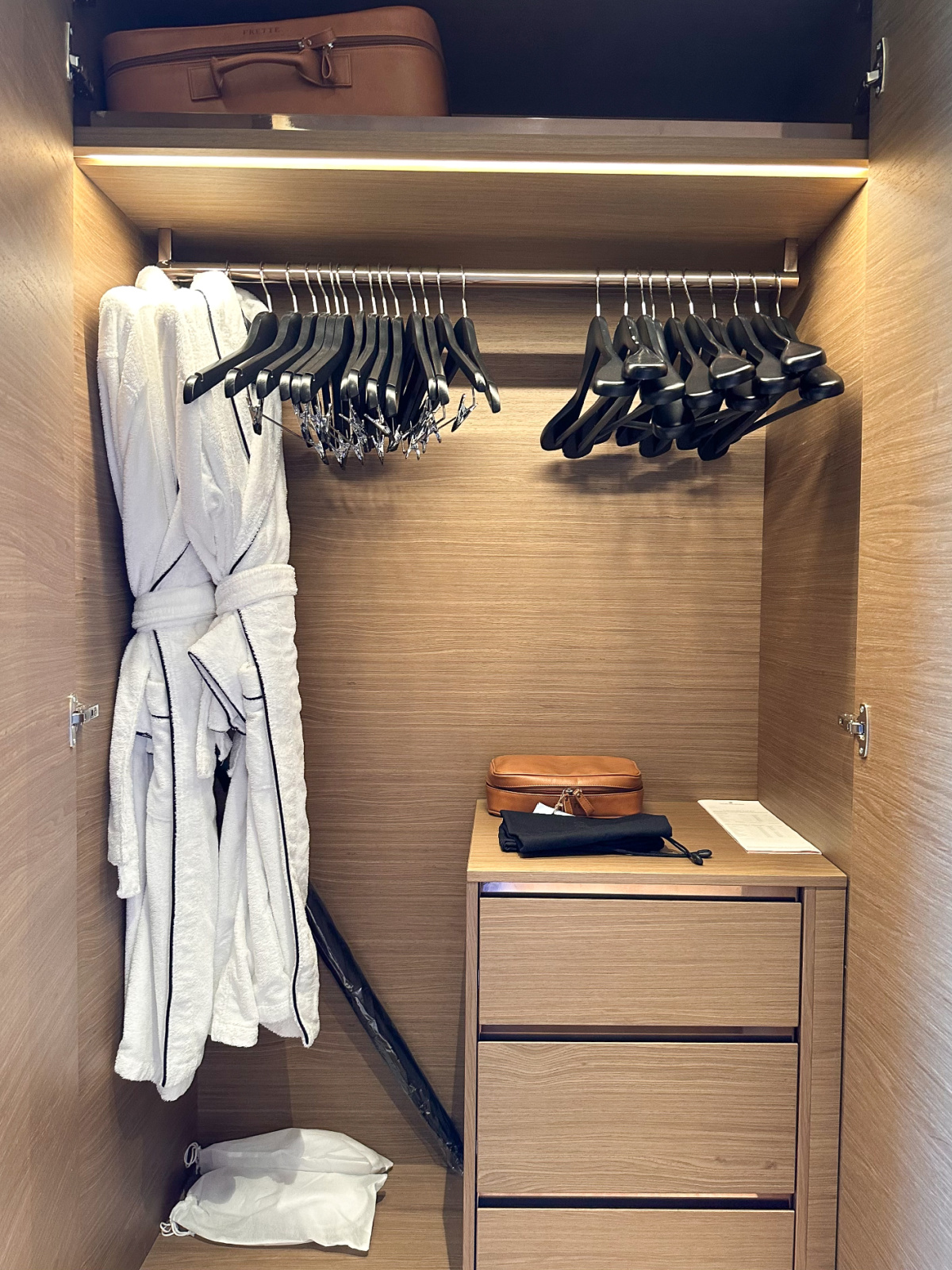 Closet space on Evrima yacht Signature Suite.
