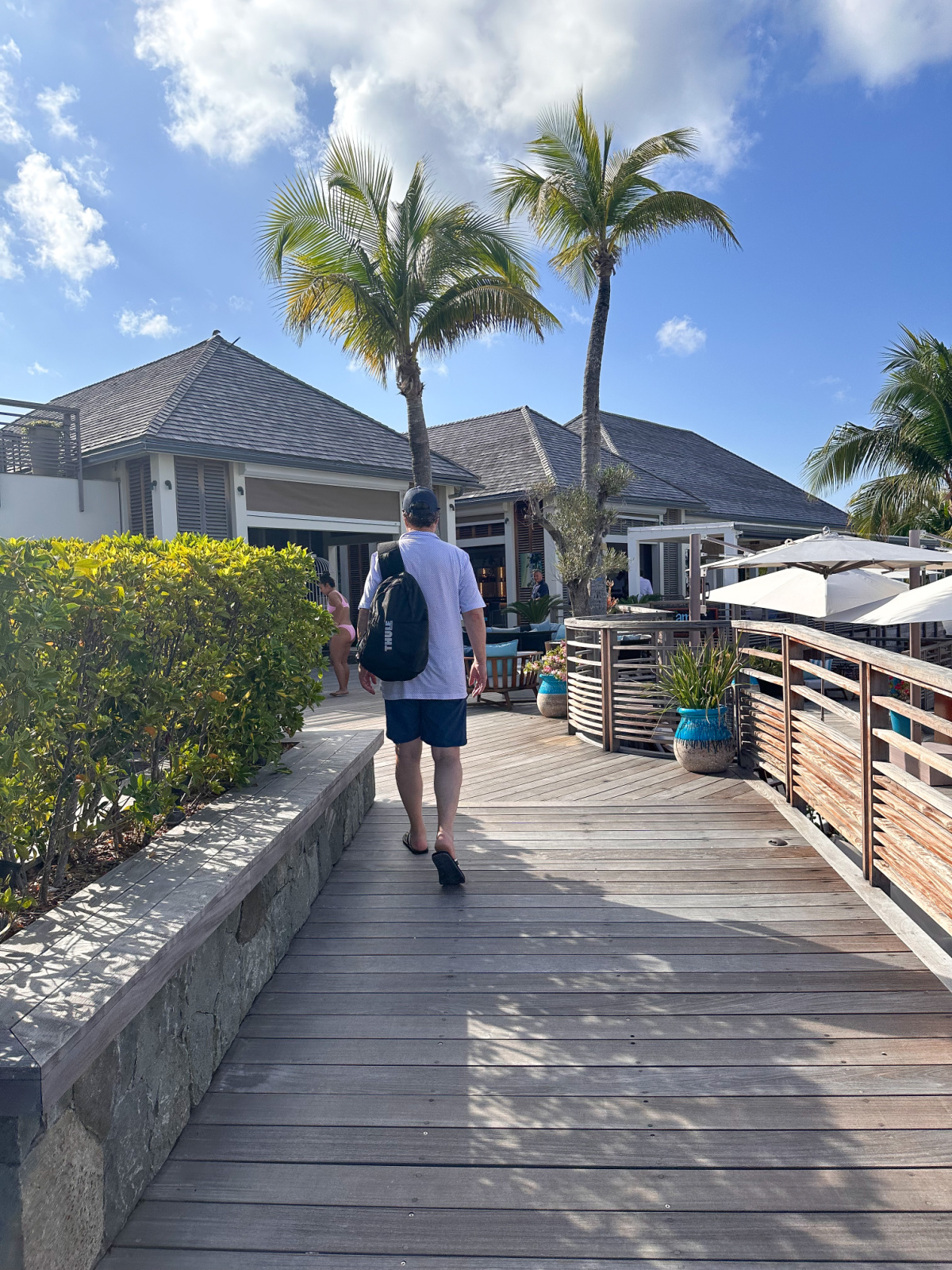 Man walking through Le Barthelemy Hotel.