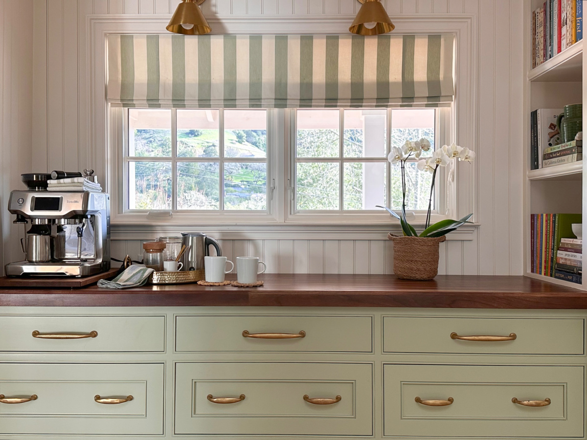 Green kitchen buffet and coffee bar.