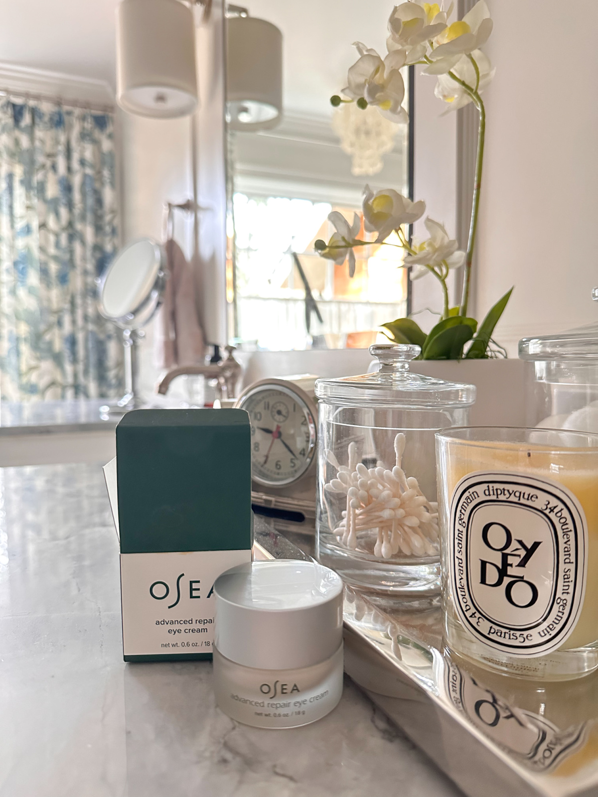 Osea eye cream on bathroom counter.