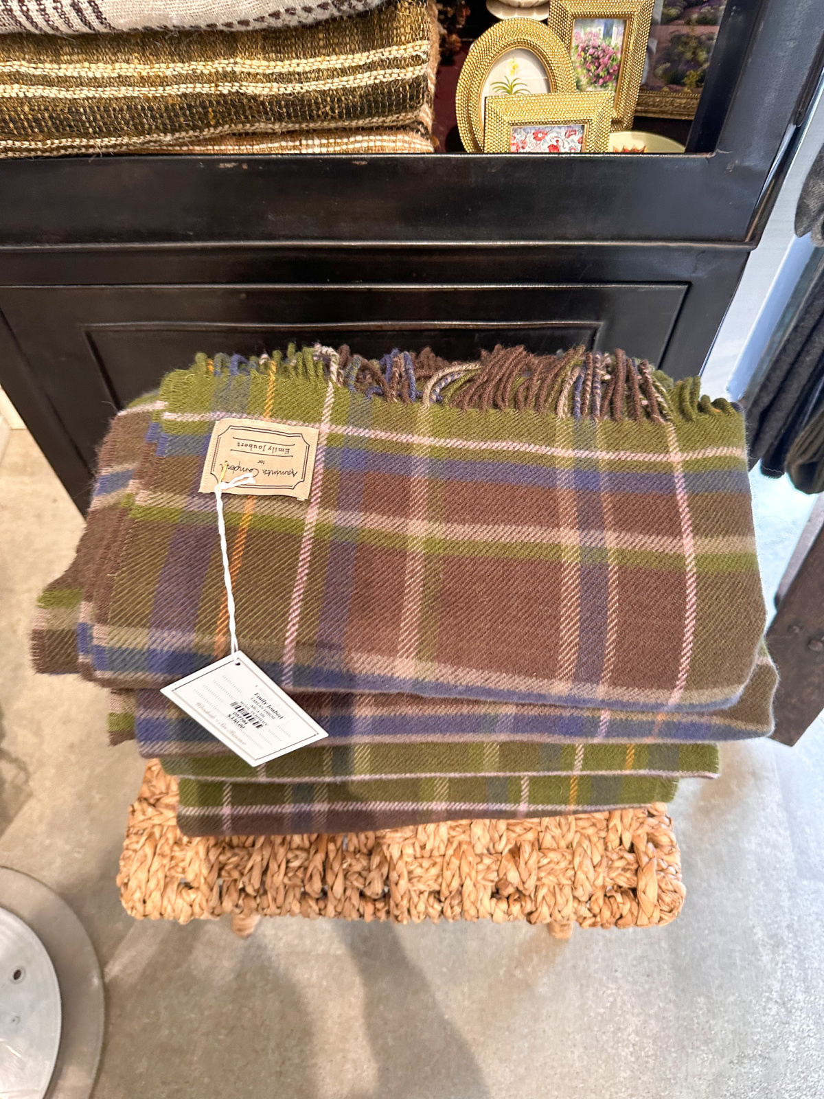 Plaid throw blankets at Emily Joubert.
