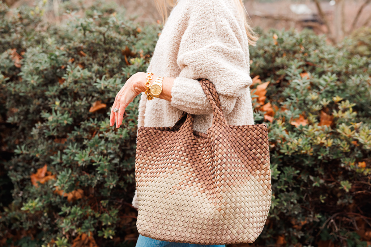Naghedi St. Baths tote on woman's arm.