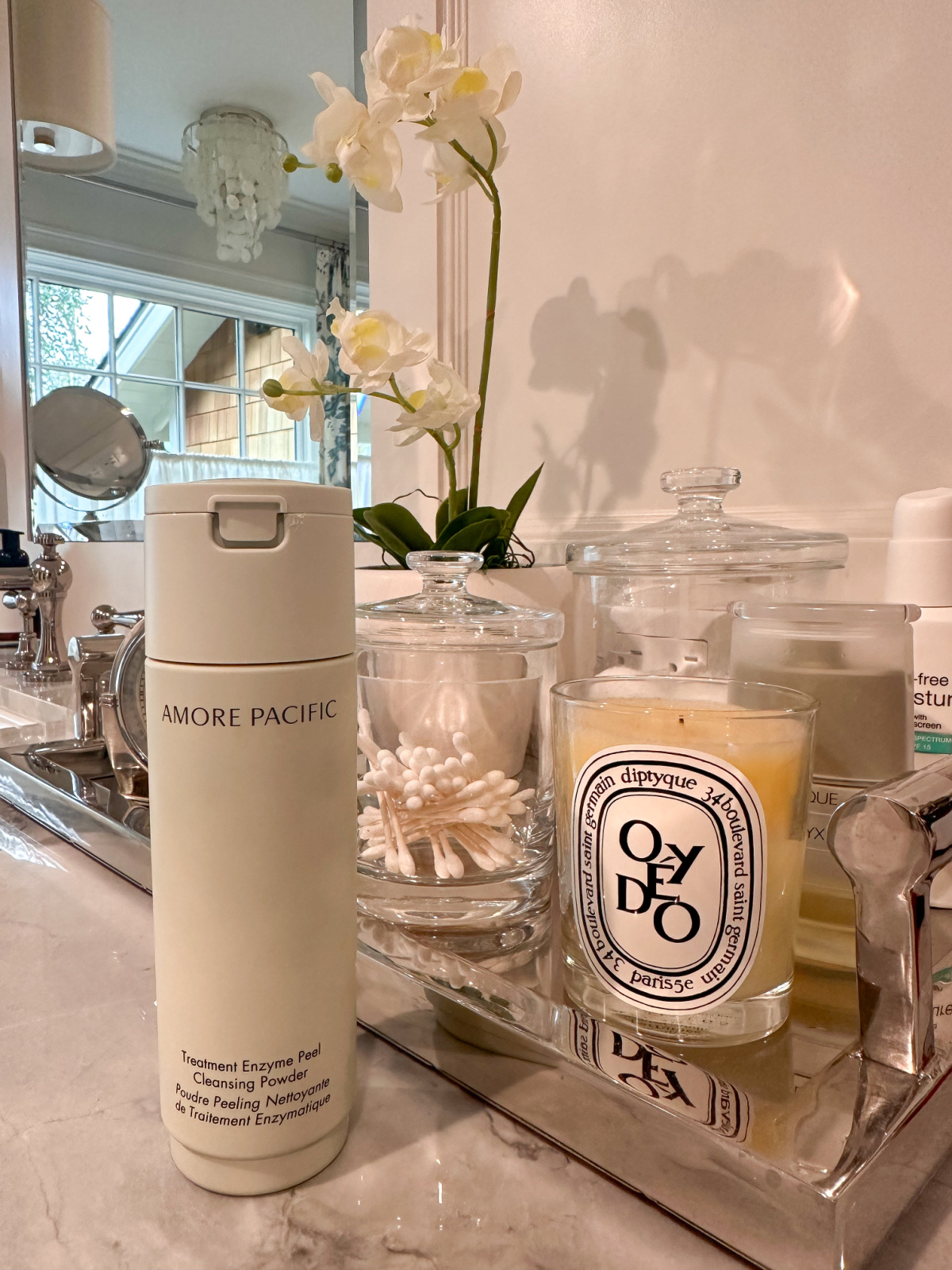 Amore Pacific Enzyme Cleaners on bathroom vanity.