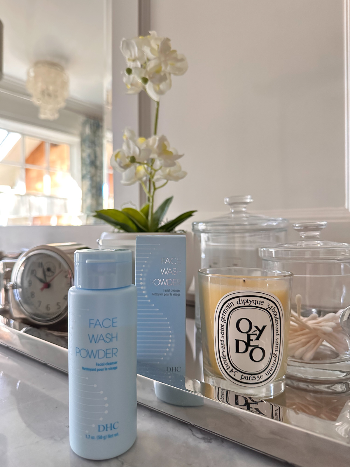 DHC facial cleaners on bathroom vanity.