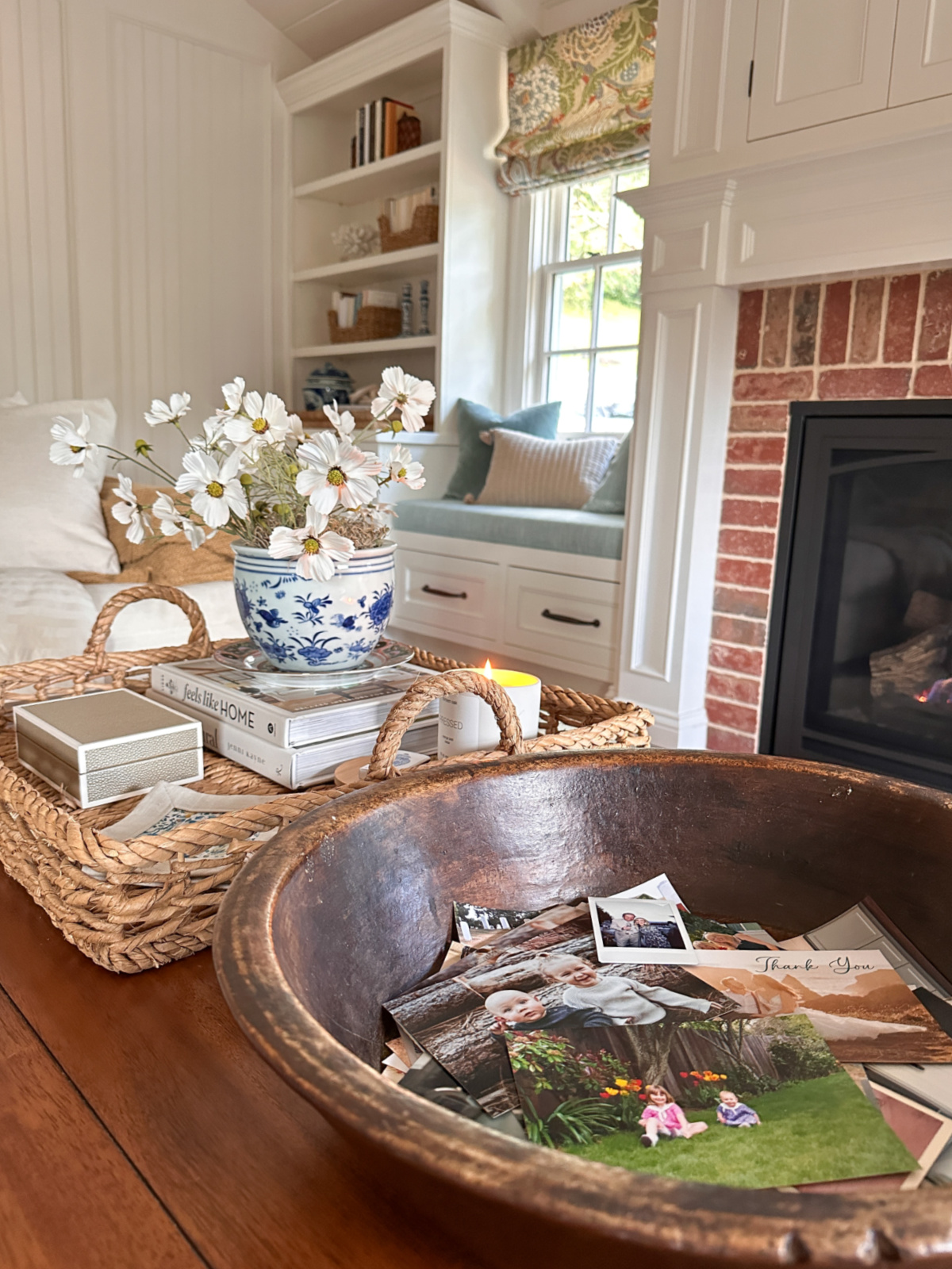 Bowl of photos on coffee table.