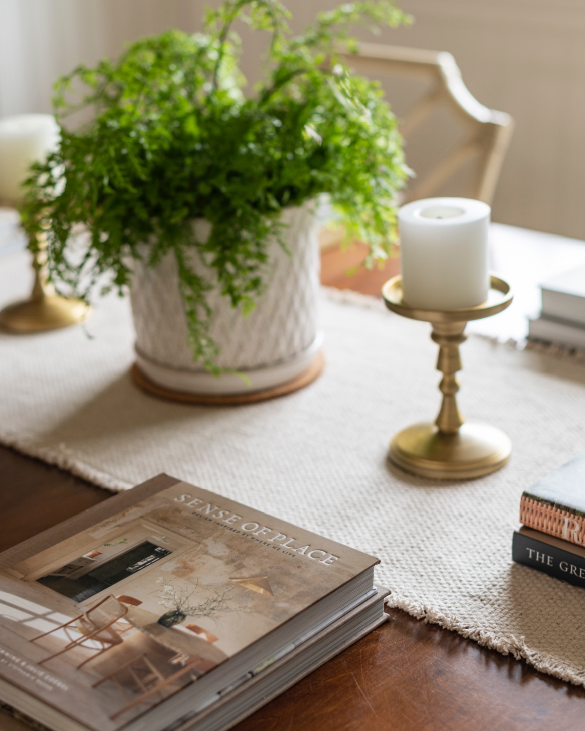 Casual dining room with table set with books.