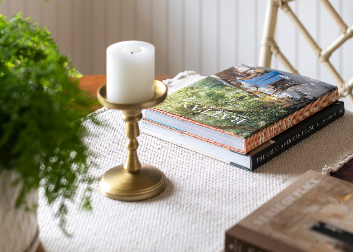 Dining table place setting with books.