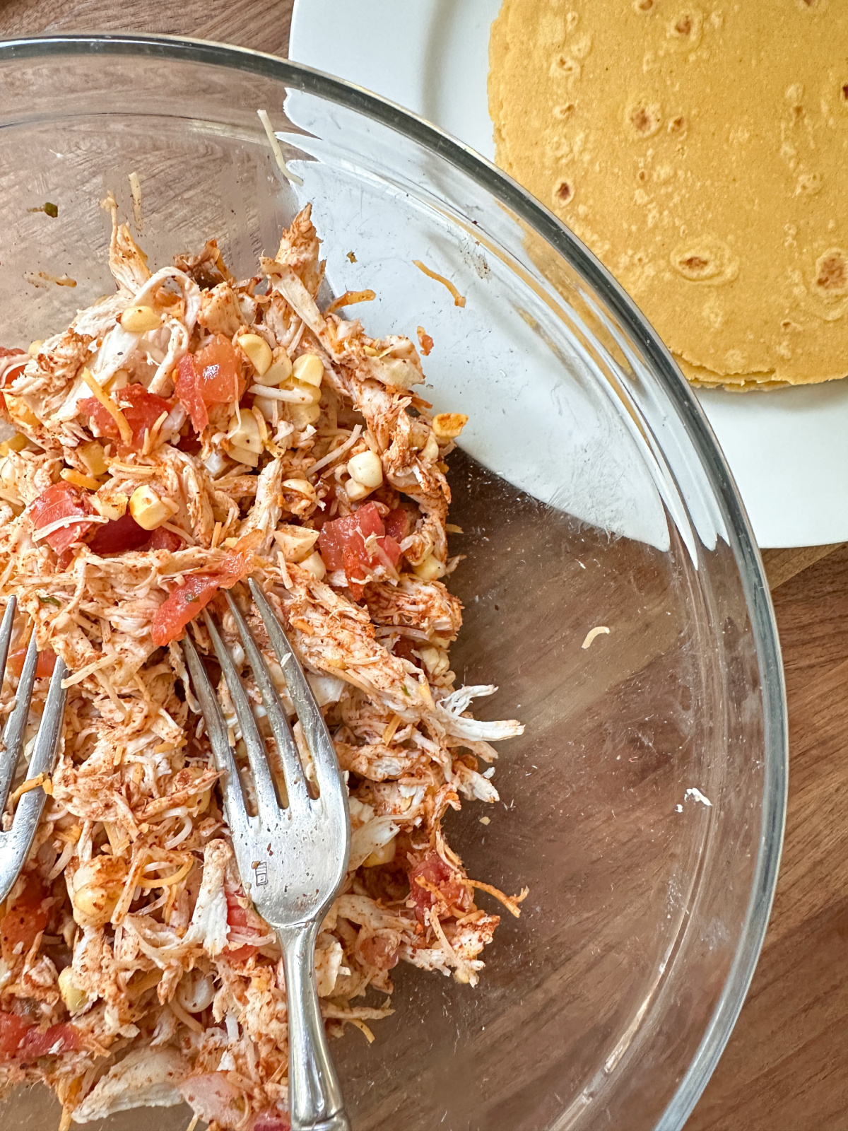 Various stages of making taquitos.