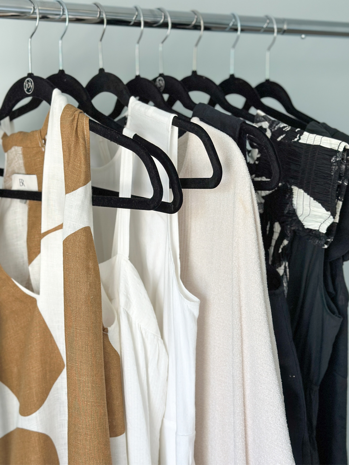 Summer dressing hanging on rack.