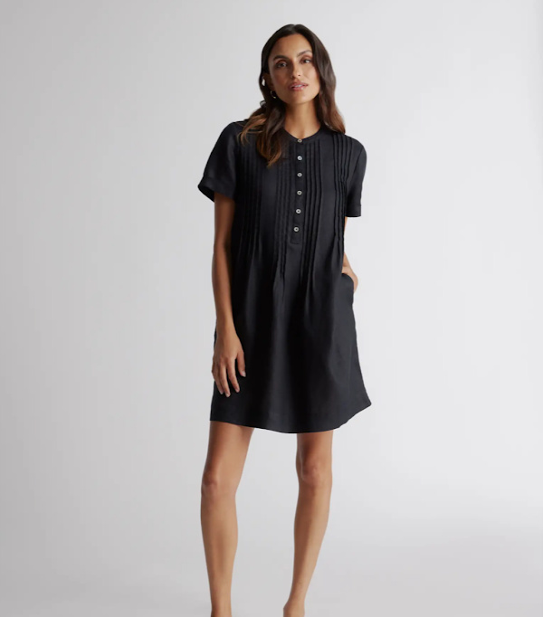 Model wearing Quince linen dress in black.