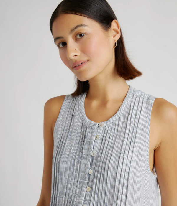 Model wearing Quince pinstripe linen dress.