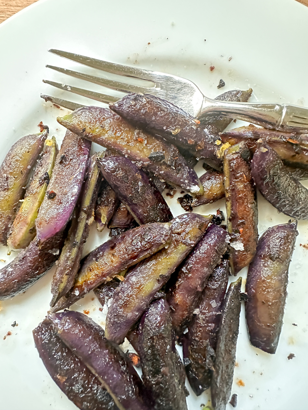 Plates of salted snap peas.