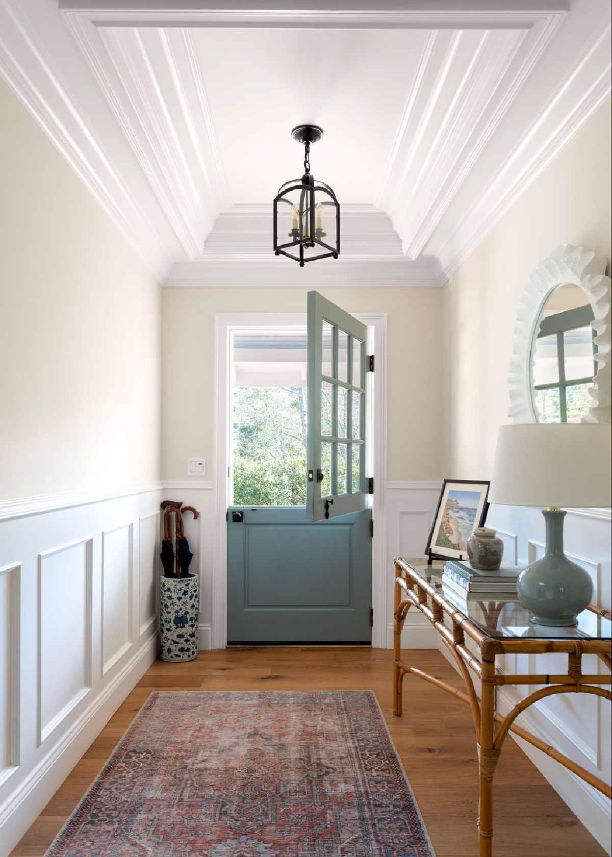 Small entryway with blue Dutch door.