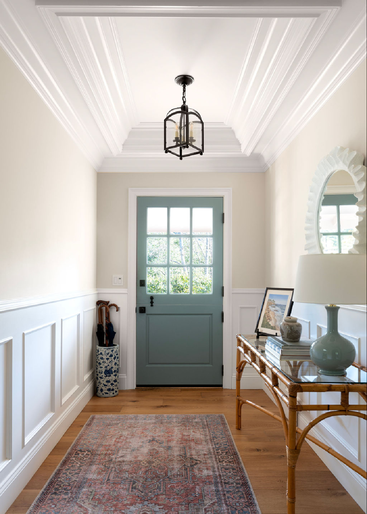 Small entryway with blue Dutch door.