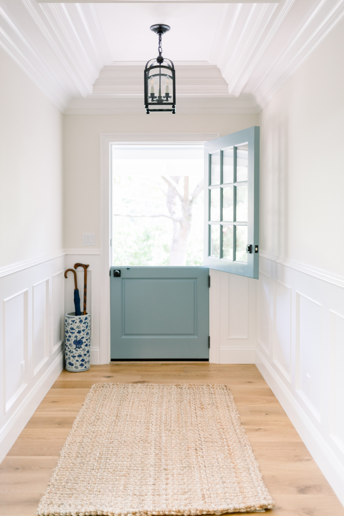 Small entry way with Oval Room Blue Dutch door.