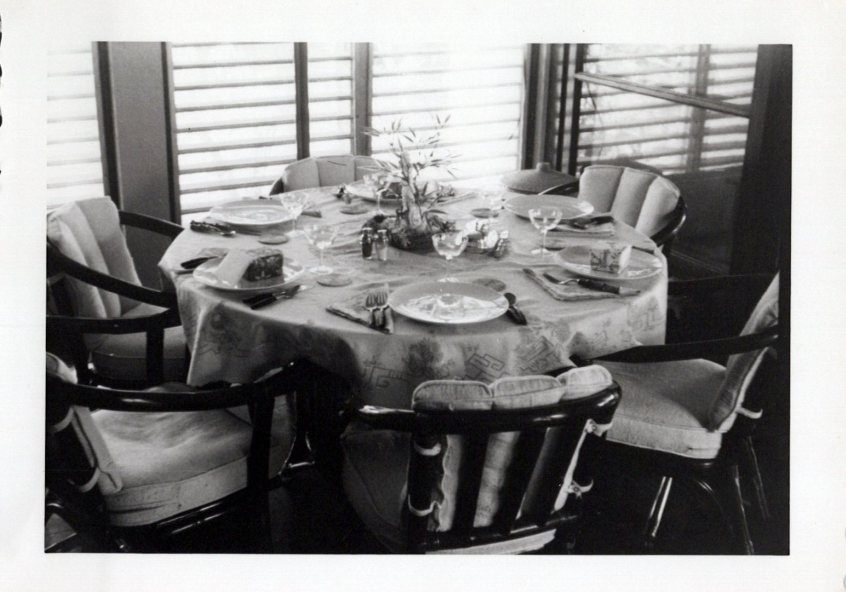 Round rattan table and chairs set for dinner in the Philippines.