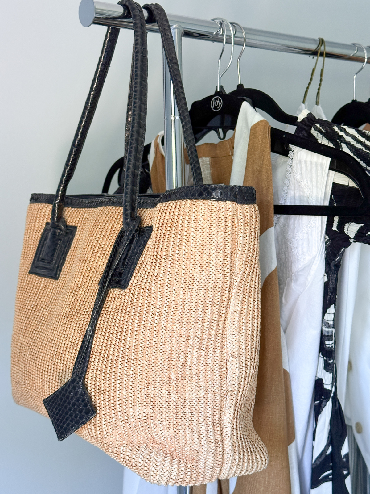 Kara Ross tote Bag handing on rolling rack.