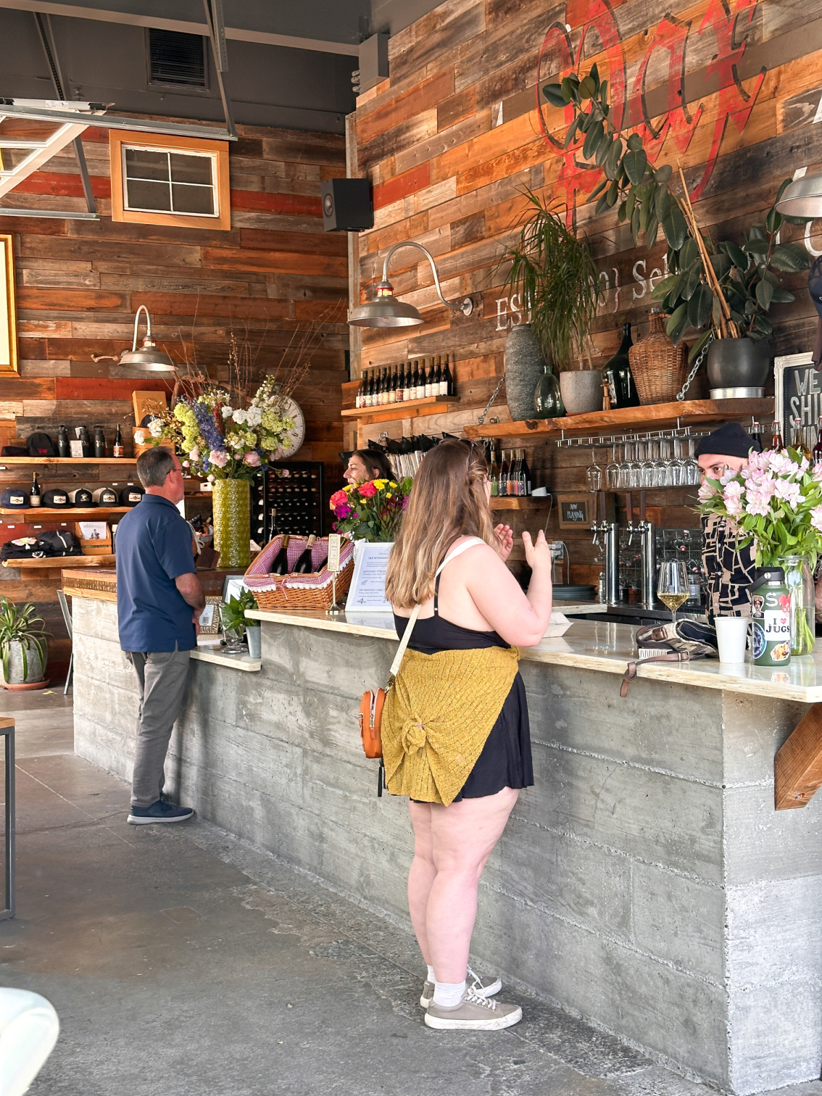 People at wine tasting bar at PAX winery.