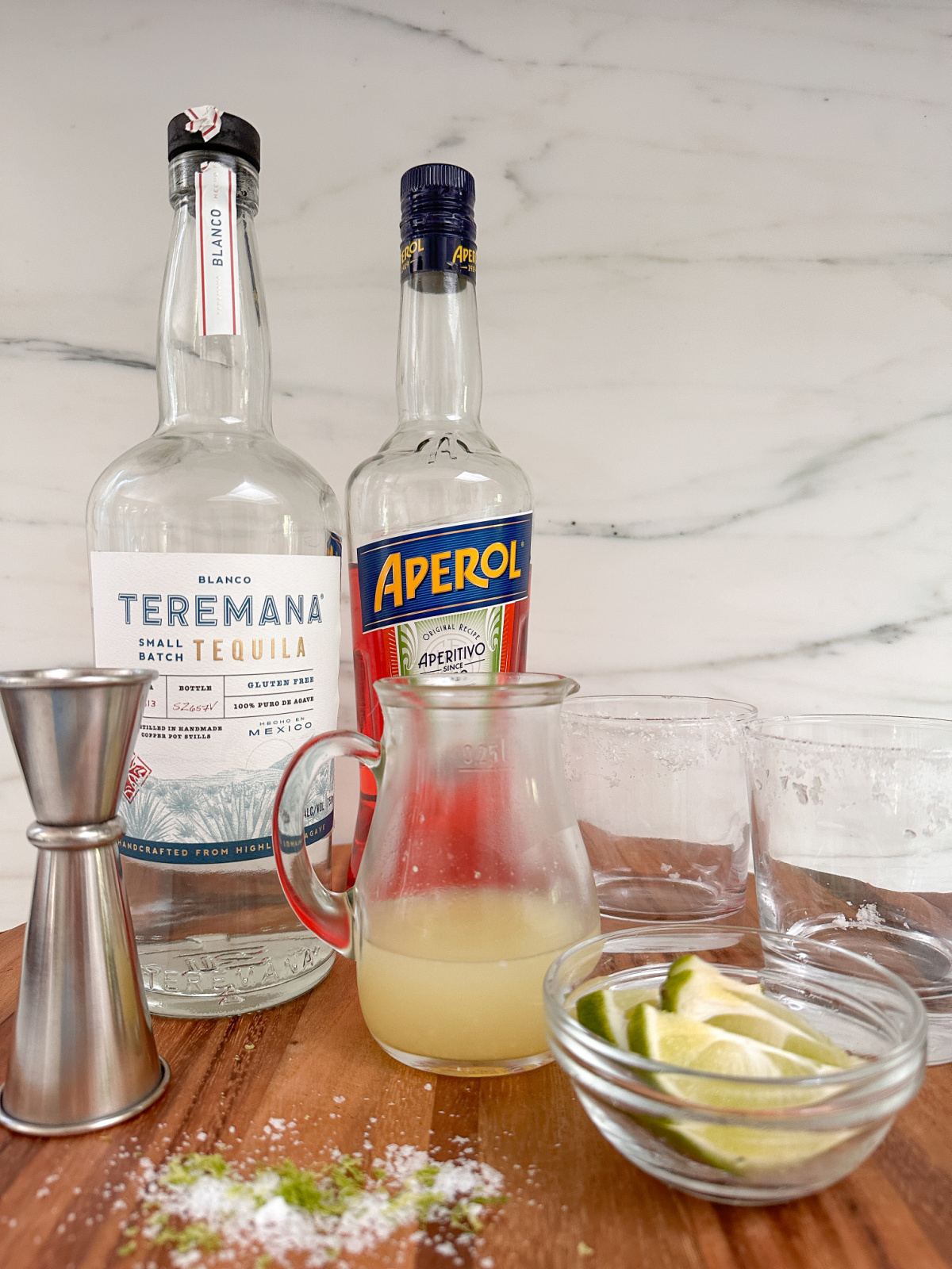 Ingredients for Aperol Margaritas on kitchen counter.