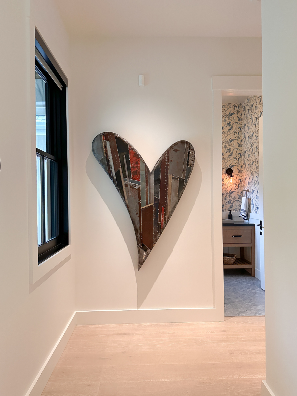 Heart sculpture on wall.