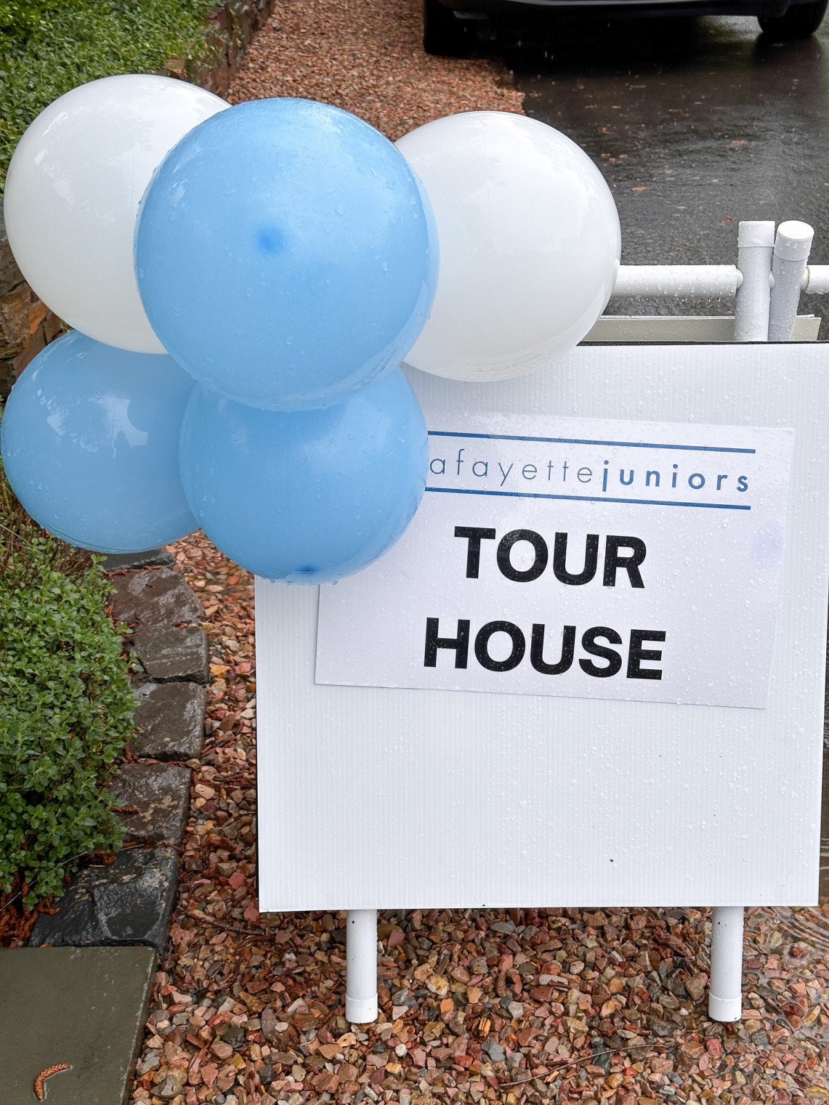 Home Tour Sign with blue and white balloons.