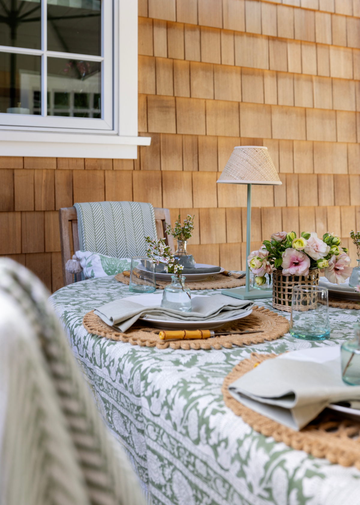 Outdoor table setting in green and white.