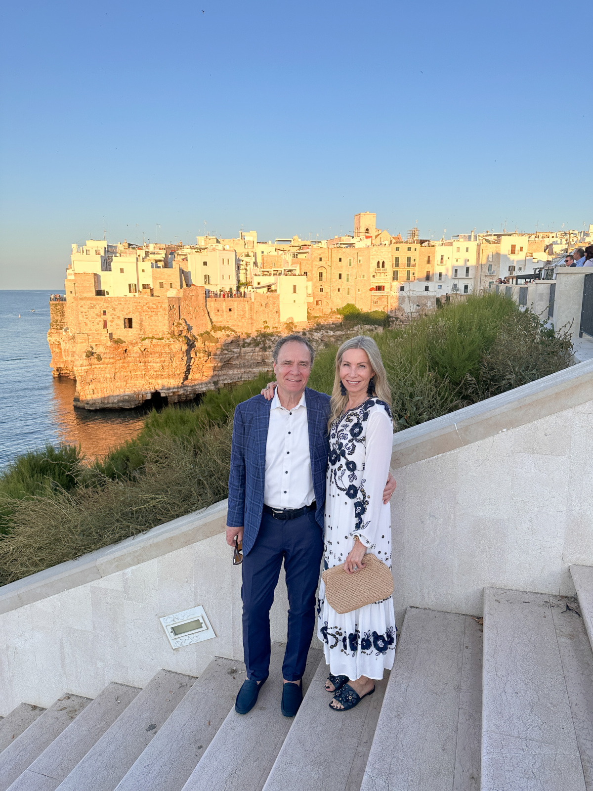 Couple at dusk in Polignano a Mare.