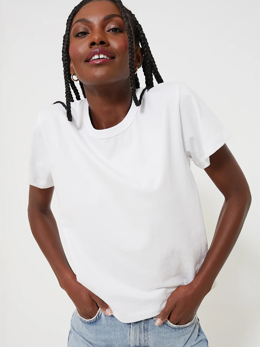 Woman wearing white t-shirt.