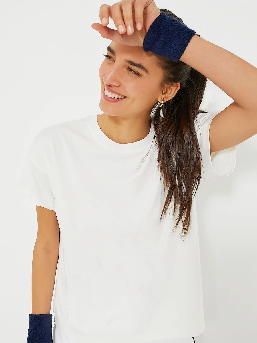 Woman wearing white t-shirt.