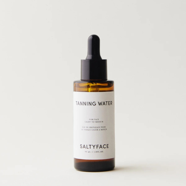 Bottle of Salty Face Tanning Water.
