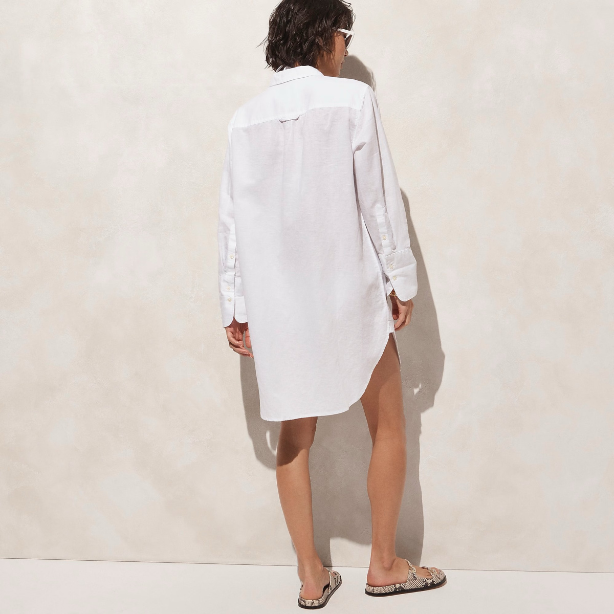 J.Crew model wearing white shirt dress.