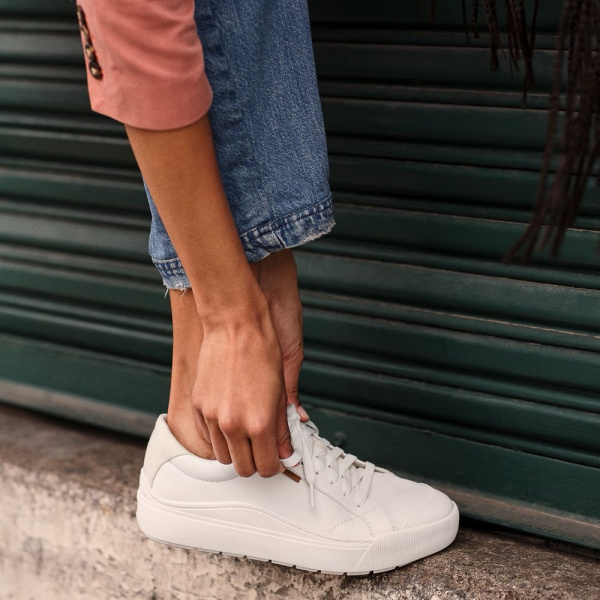 Photo of someone wearing Dr. Scholl's time Off Sneaker.