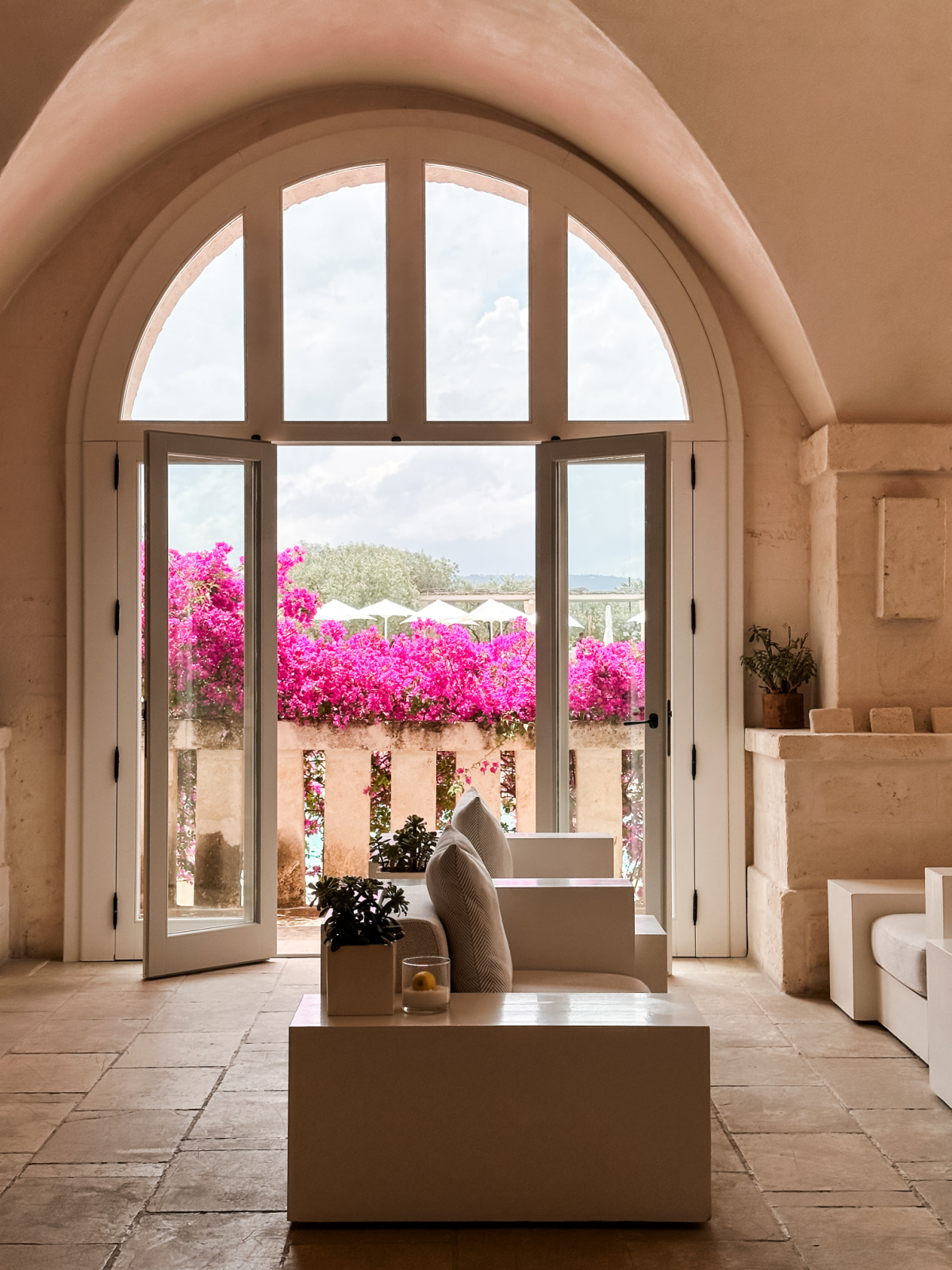 Seating area looking out to balcony at Borgo Egnazia.