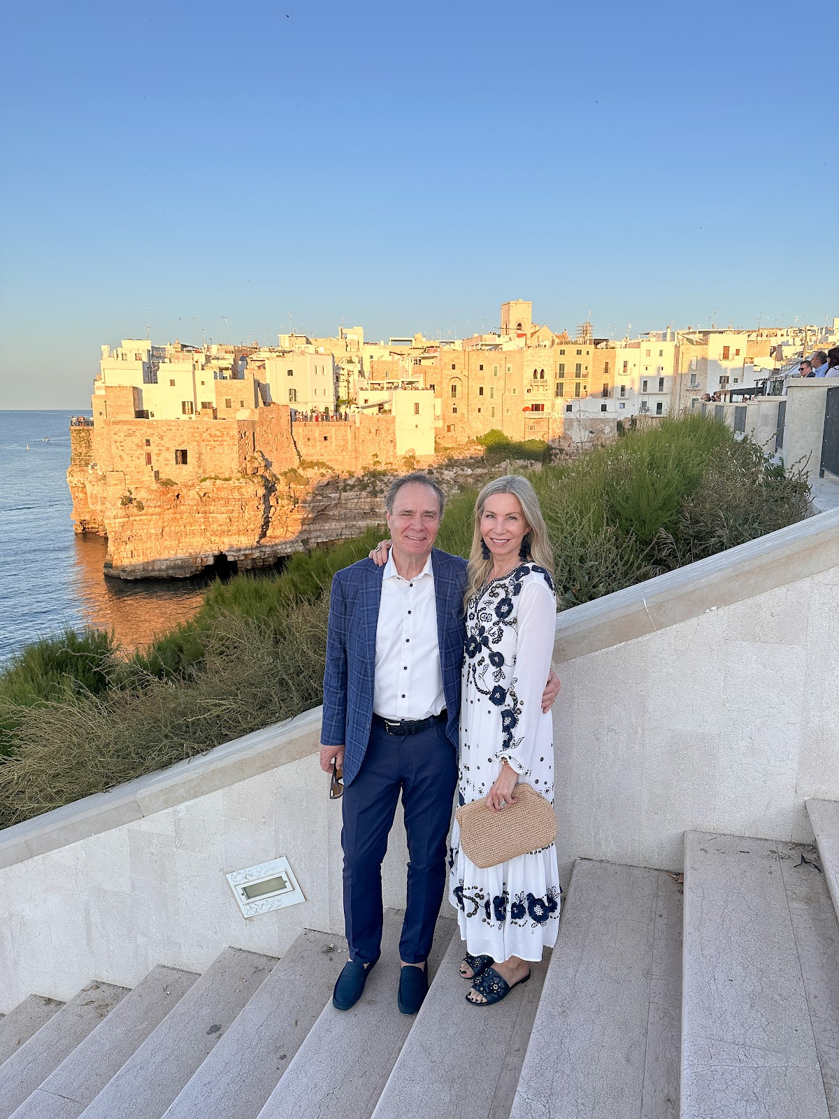 Couple posting for photo in Polignano a Mare.
