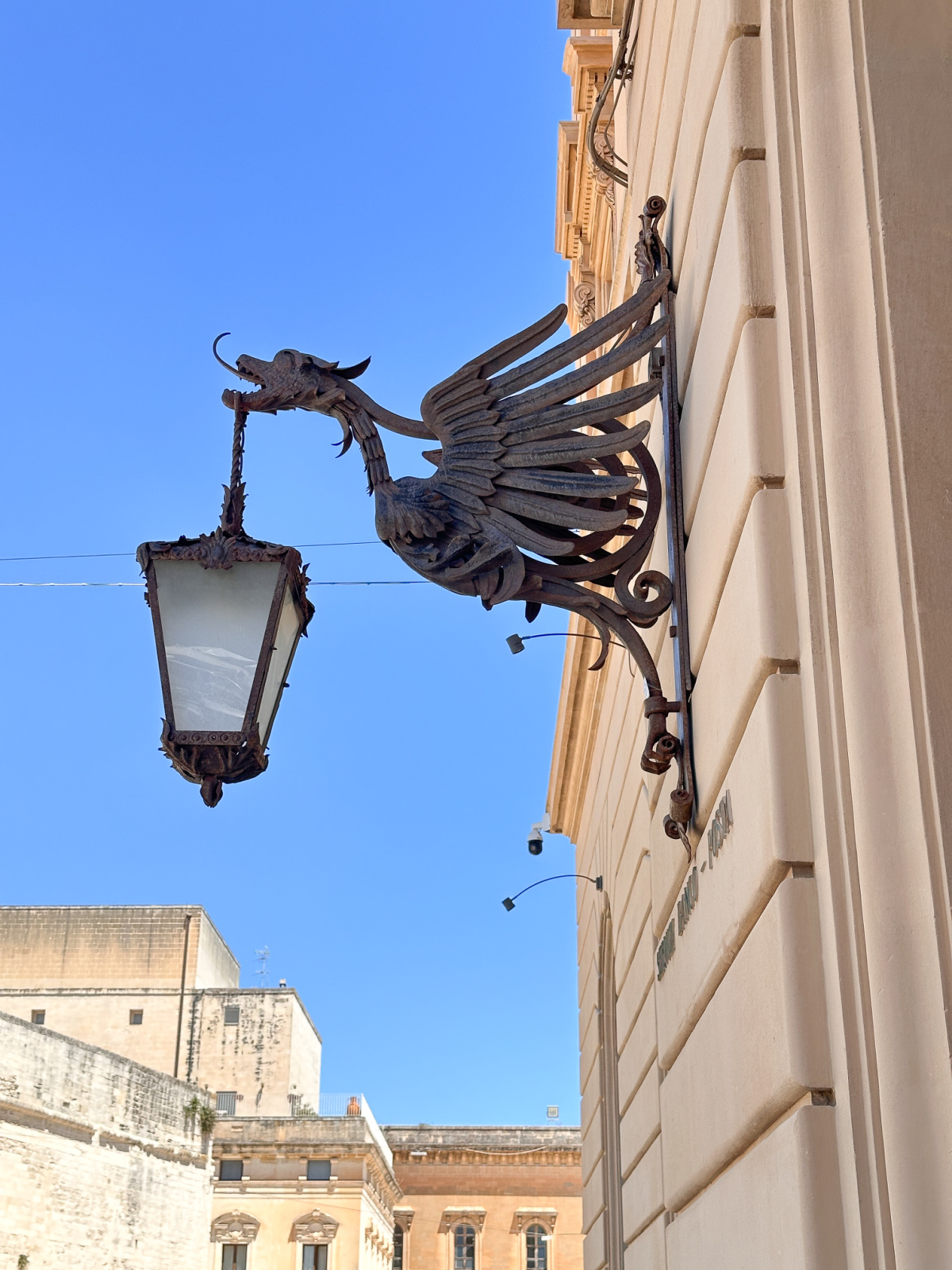 Lantern on old building in Lecce.