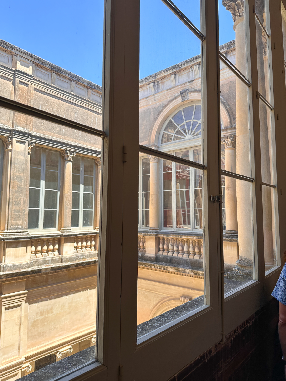 Window looking out to courtyard at Palazzo Tamborino Cezzi.