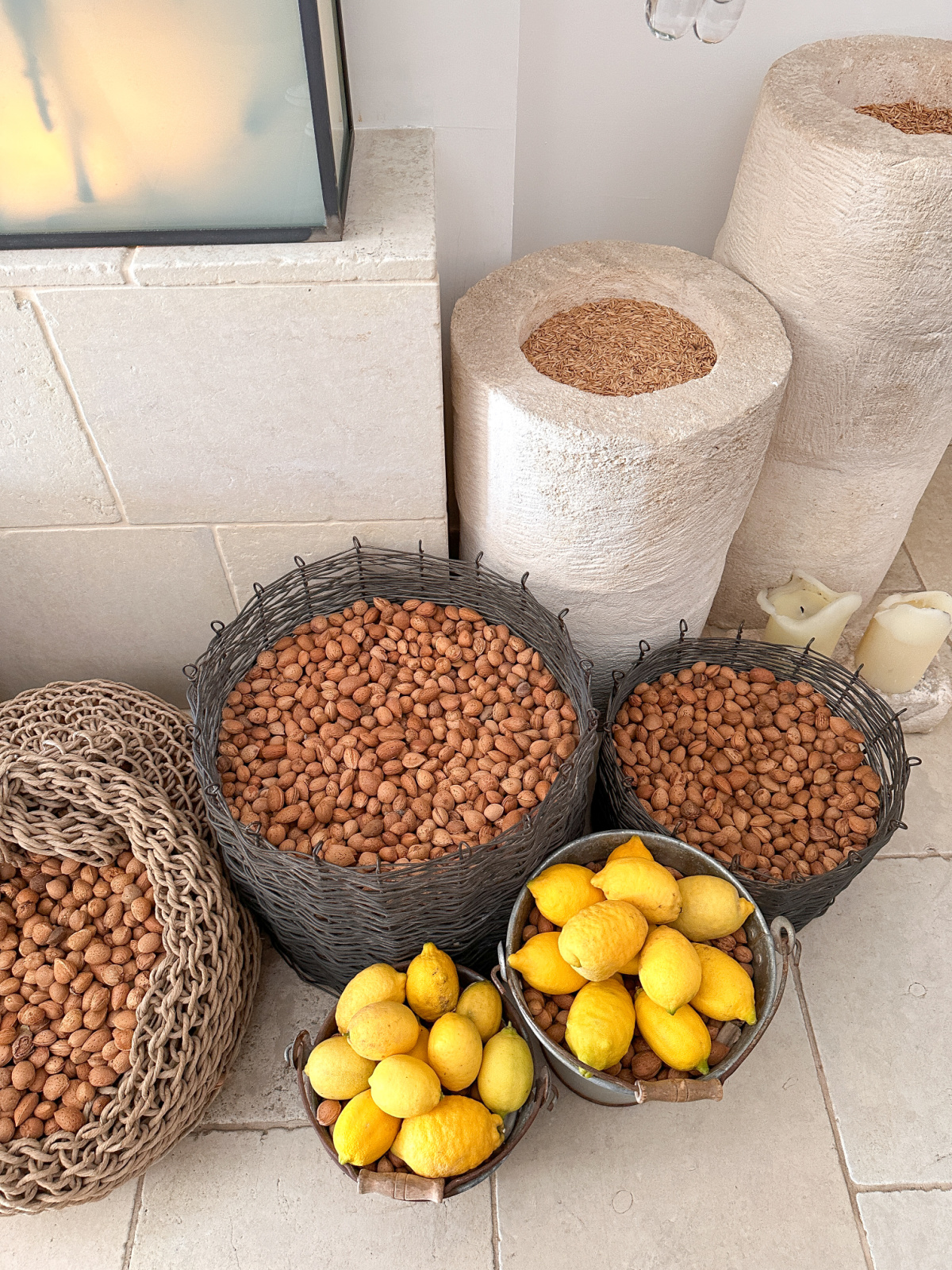 Hallway with vessels filled with nuts and lemons at Borgo Egnazia.
